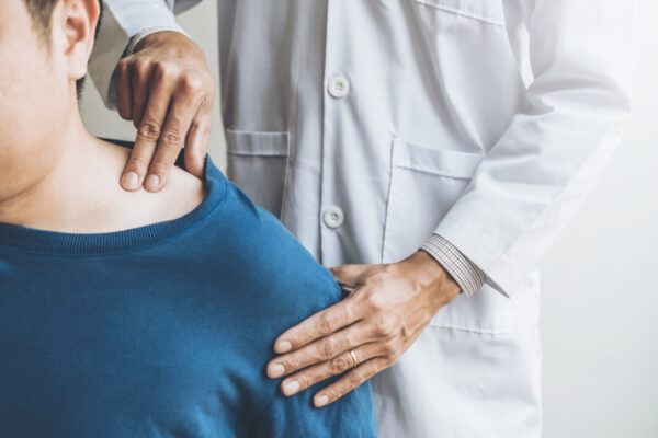 Physical Doctor consulting with patient About Shoulder muscule p
